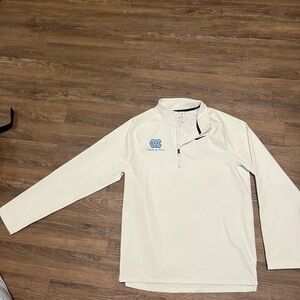 Clean white Nike UNC Golf pullover with track and field branding